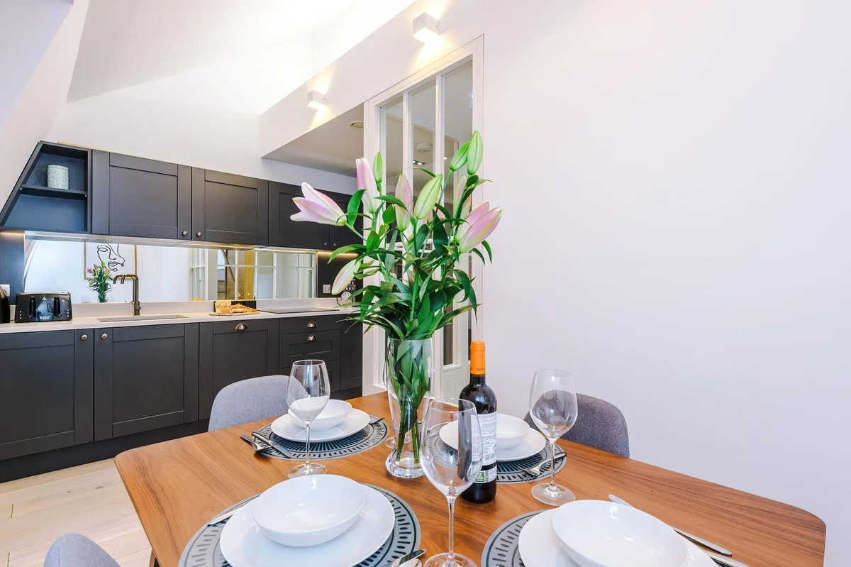 Hilltop apartment kitchen dining with designer styling